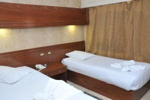 Voodi või voodid majutusasutuse Salma Hotel Cairo toas