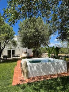 a swimming pool in the yard of a house at Casa Nova Vida in Paderne