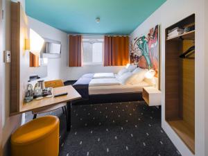 Krevet ili kreveti u jedinici u objektu B&B Hotel Leipzig-City