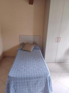 Postel nebo postele na pokoji v ubytování Punto Accoglienza POLICASTRELLO