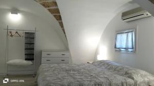 Postel nebo postele na pokoji v ubytování Corte di Puglia