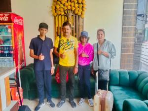 a group of people standing in front of a couch at Avista Hotel in Amritsar