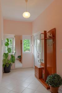 a bathroom with a sink and a mirror at Villa M Cako in Ksamil