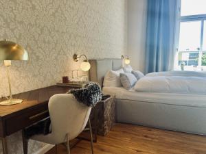 Postel nebo postele na pokoji v ubytování Lexow - Hotel an de Havenkant