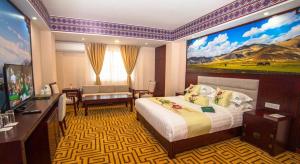 Rúm í herbergi á Kamalashi Boutique Inn