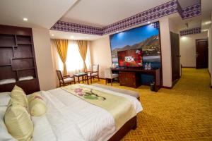 Rúm í herbergi á Kamalashi Boutique Inn