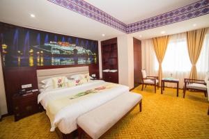 Rúm í herbergi á Kamalashi Boutique Inn