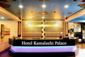 Rúm í herbergi á Kamalashi Boutique Inn
