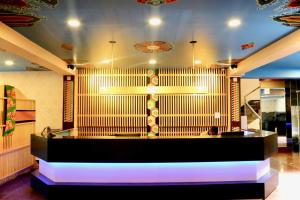 Rúm í herbergi á Kamalashi Boutique Inn