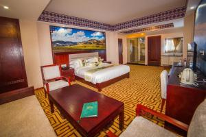 Rúm í herbergi á Kamalashi Boutique Inn