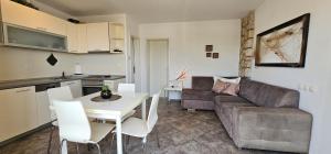 a living room with a couch and a table at Apartman Chilli in Dramalj