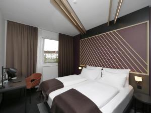 Postel nebo postele na pokoji v ubytování B&B Hotel Berlin City-Ost