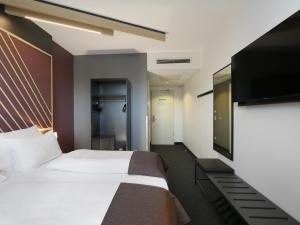 Postel nebo postele na pokoji v ubytování B&B Hotel Berlin City-Ost