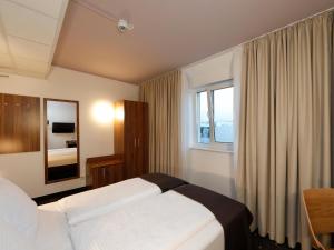 Postel nebo postele na pokoji v ubytování B&B Hotel Berlin City-Ost