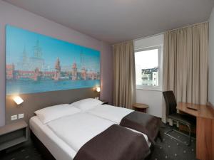Postel nebo postele na pokoji v ubytování B&B Hotel Berlin City-Ost