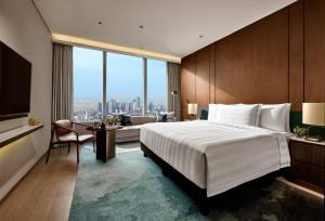 Pan Pacific Jakarta客房内的一张或多张床位