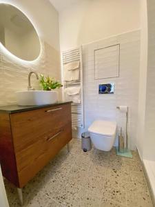 a bathroom with a sink and a toilet at Stylish Studio near Dejvická metro station in Prague