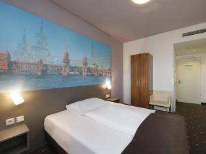 Postel nebo postele na pokoji v ubytování B&B Hotel Berlin City-Ost