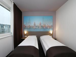 Postel nebo postele na pokoji v ubytování B&B Hotel Berlin City-Ost