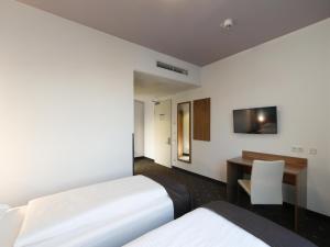 Postel nebo postele na pokoji v ubytování B&B Hotel Berlin City-Ost
