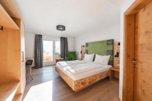 Posteľ alebo postele v izbe v ubytovaní Genusshotel Fichtenhof