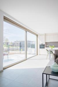 a living room with a large sliding glass door at Green HOME Wieze in Wieze +32 photos