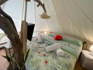 a bed in a tent with red pills on it at Re dream suite a tema - Rapallo in Rapallo +132 photos