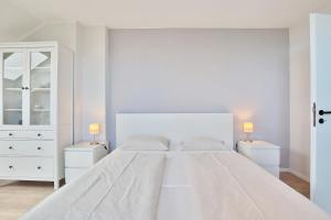 Ein Bett oder Betten in einem Zimmer der Unterkunft Haus Adria Haus Adria Appartement 29