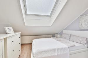 Ein Bett oder Betten in einem Zimmer der Unterkunft Haus Adria Haus Adria Appartement 29