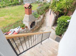 a view of a backyard with a brick fireplace at Holiday Home Riva in Ston +61 photos