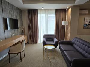 TV a/nebo společenská místnost v ubytování Perla Hotel
