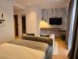 TV a/nebo společenská místnost v ubytování Perla Hotel