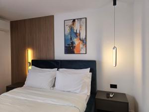 Postel nebo postele na pokoji v ubytování Perla Hotel