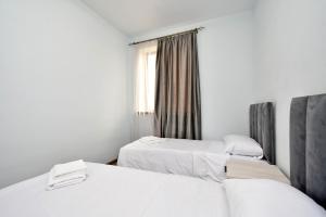 Ένα ή περισσότερα κρεβάτια σε δωμάτιο στο EvnAir