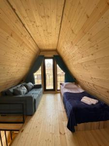 מיטה או מיטות בחדר ב-Panorama cottages in Sno