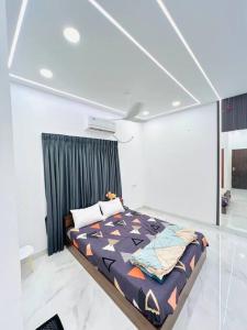 a bedroom with a bed in a room at HemaRay villa - luxury stay with pool in Chennai