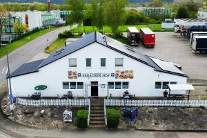 a large white building with a fast food restaurant at Erbacher Hof in Homburg