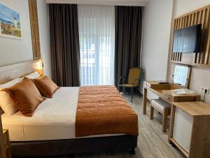 Voodi või voodid majutusasutuse Hotel Panaya toas
