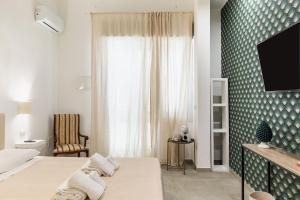 Μια τηλεόραση ή/και κέντρο ψυχαγωγίας στο Il Moro Rooms +33 φωτογραφίες