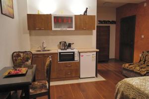 a small kitchen with a sink and a refrigerator at Rooms Filip in Bitola