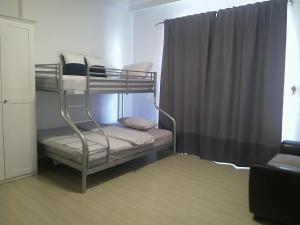 a bunk bed in a room with a window at Saraya Al Olaya Tower family house in Al Khobar