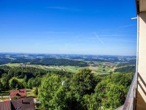 a view of the countryside from the balcony of a house at Inviting apartment in Freyung with sauna indoor pool in Freyung