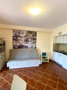 a kitchen with a bed in the middle of a room at Apartments Villa Viktoria in Tivat