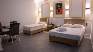 Postel nebo postele na pokoji v ubytování Global Termal Hotel