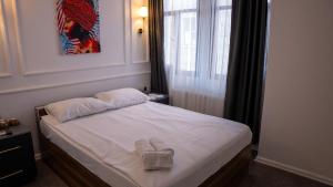 Postel nebo postele na pokoji v ubytování Global Termal Hotel