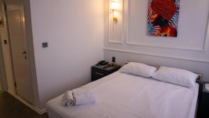 Postel nebo postele na pokoji v ubytování Global Termal Hotel