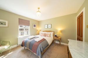 Llit o llits en una habitació de Binrock Lodge