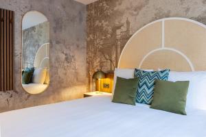 Postel nebo postele na pokoji v ubytování Leonardo Hotel Breda City Center