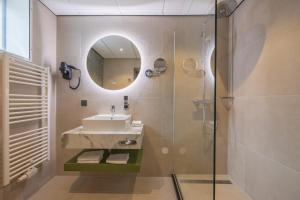 Koupelna v ubytování Leonardo Hotel Breda City Center
