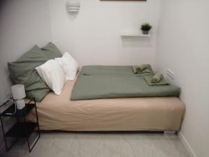 Posteľ alebo postele v izbe v ubytovaní Kolibri Apartmen
